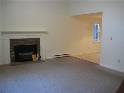 136 Ebenezer Road Osterville, MA 02655 - Photo 4 of 10 an empty room with a fireplace