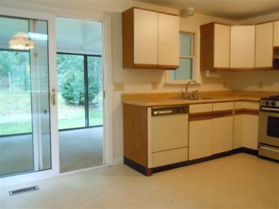 136 Ebenezer Road Osterville, MA 02655 - Photo 8 of 10 a kitchen with stainless steel appliances granite countertop a stove a sink and a refrigerator