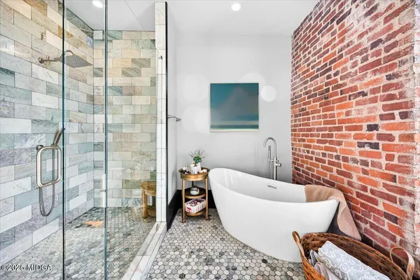 a bathroom with a bathtub and shower