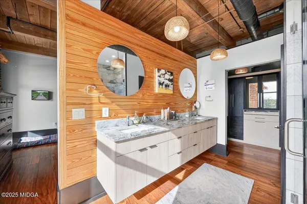 a bathroom with a sink mirror vanity and toilet