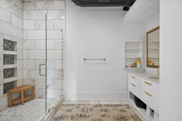 a bathroom with a sink and a shower