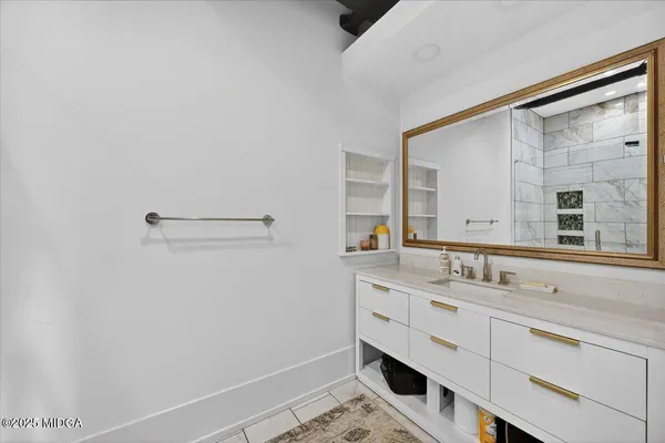 a bathroom with a sink and a mirror