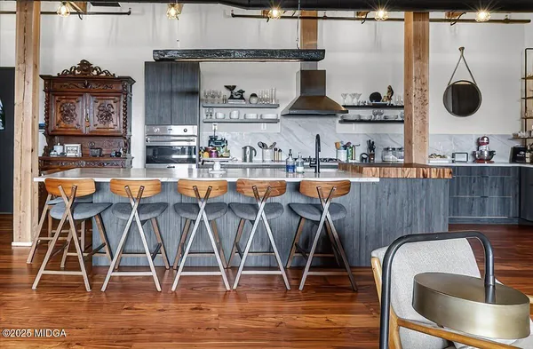 a room with granite countertop wooden floors