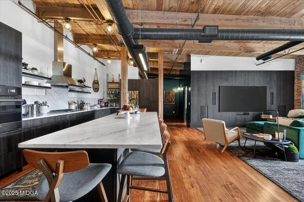 a outdoor dining space with furniture and a fireplace