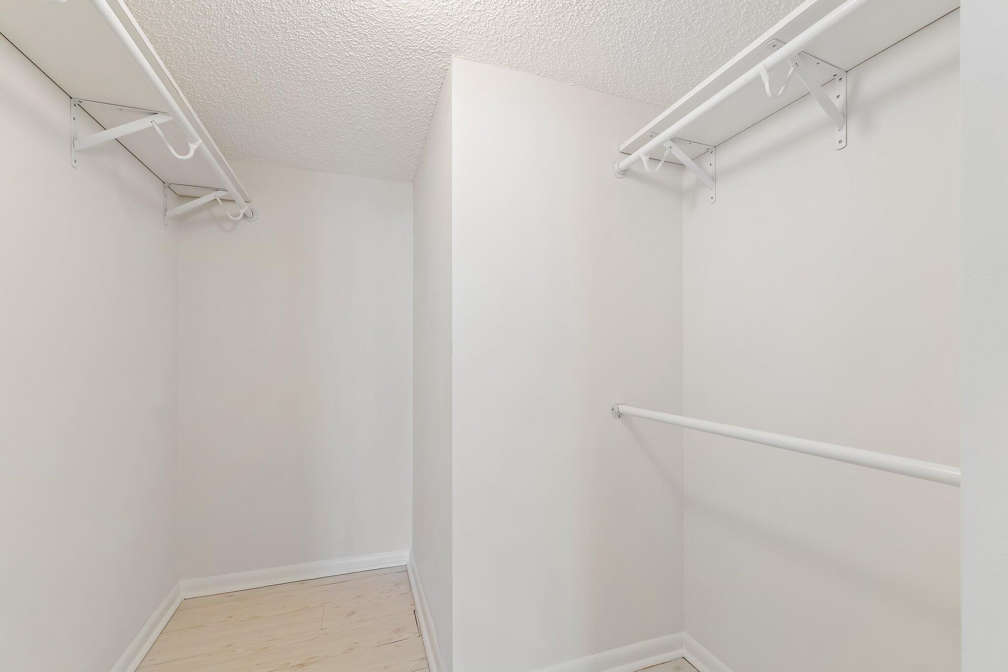 300 Ocean Trail Way, Unit 1406 Jupiter, FL 33477 - Photo 32 of 42 a view of walk in closet with empty racks