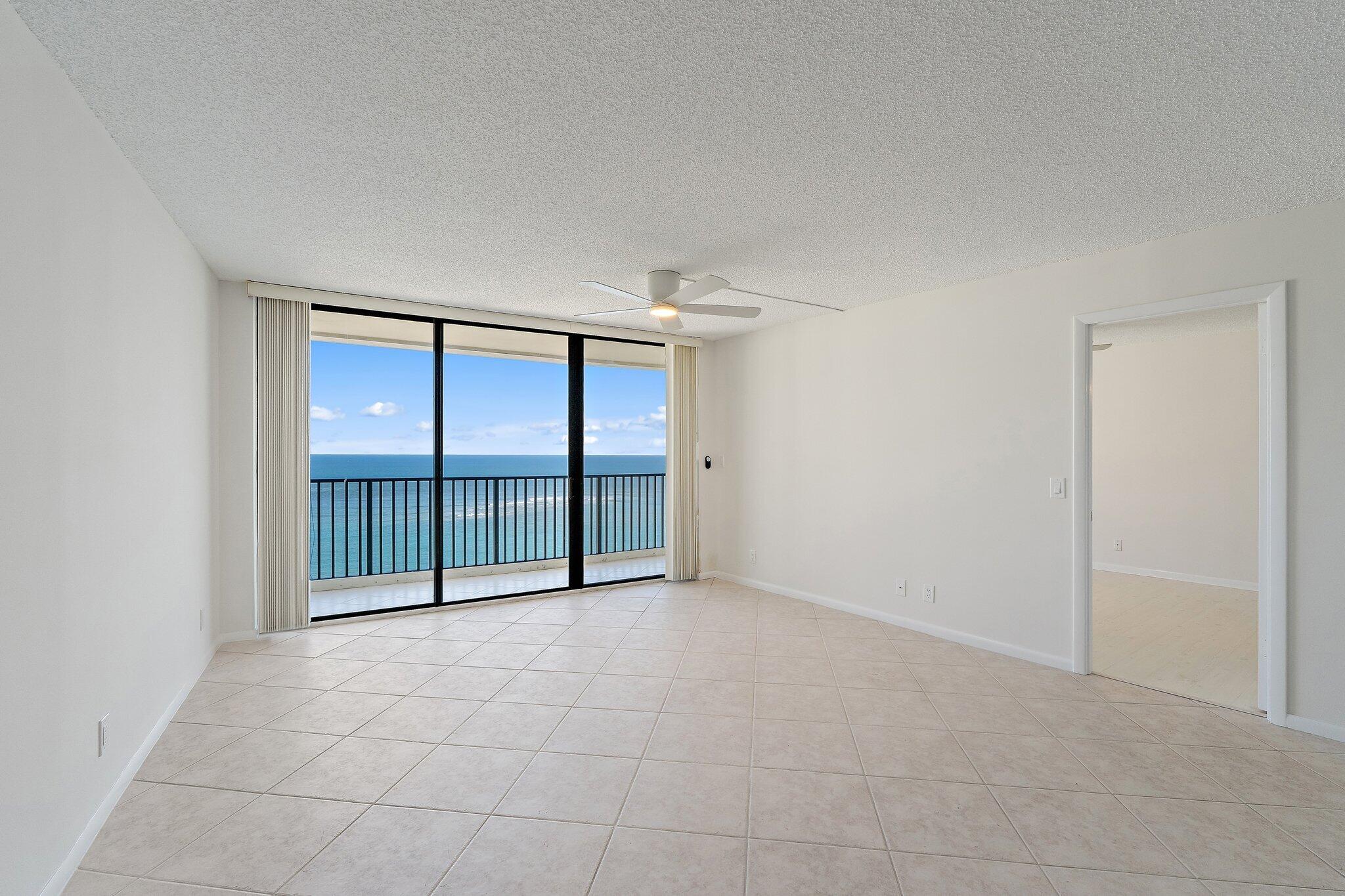 300 Ocean Trail Way, Unit 1406 Jupiter, FL 33477 - Photo 9 of 42 a view of an empty room with a sliding door