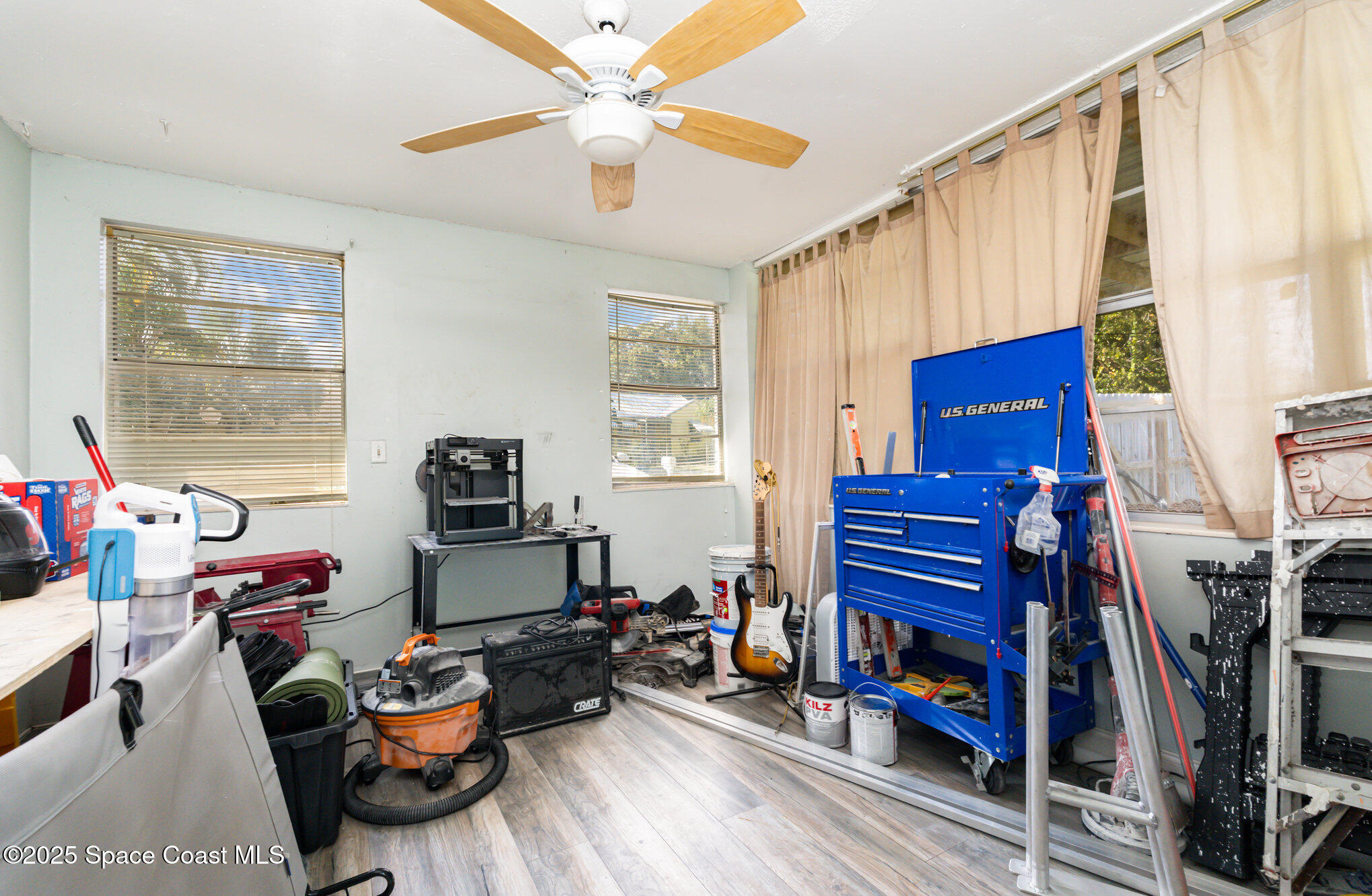 1137 Delmar Terrace Palm Bay, FL 32905 - Photo 13 of 35 a living room with furniture a flat screen tv and a window