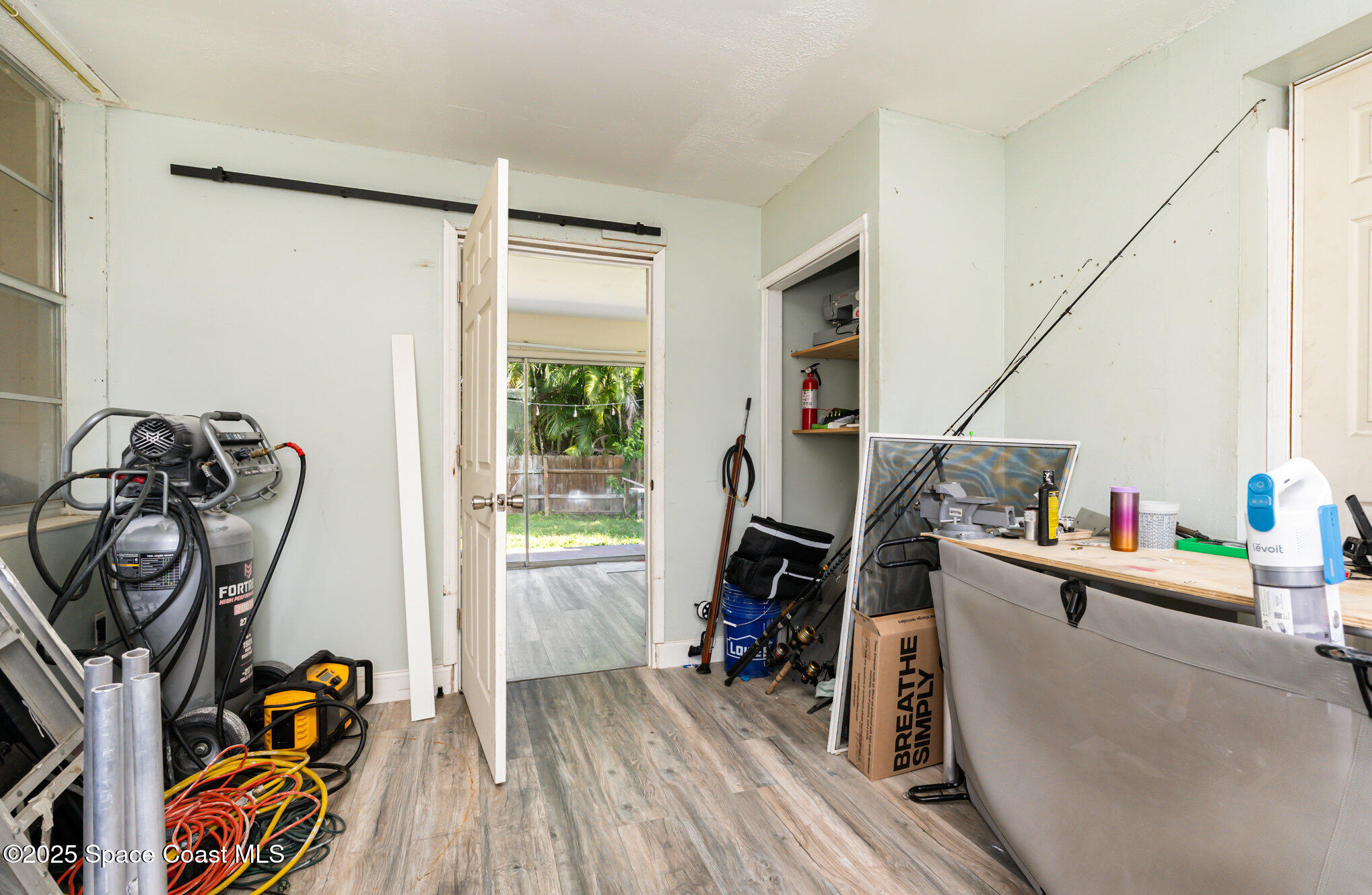 1137 Delmar Terrace Palm Bay, FL 32905 - Photo 14 of 35 a view of a room with gym equipment