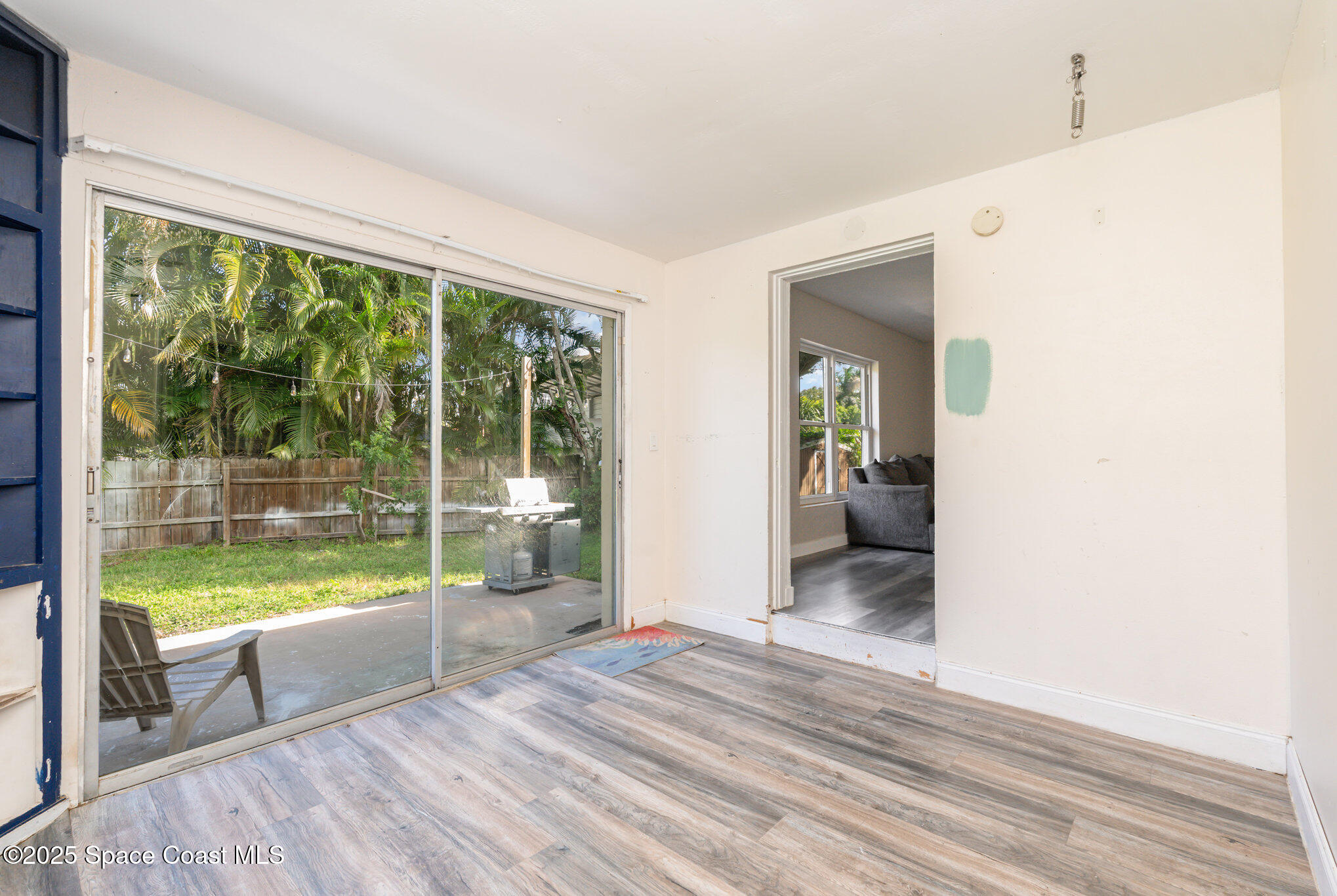 1137 Delmar Terrace Palm Bay, FL 32905 - Photo 16 of 35 a bedroom with a bed and glass door