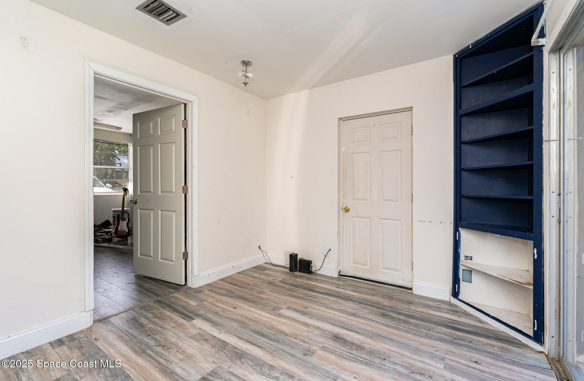 1137 Delmar Terrace Palm Bay, FL 32905 - Photo 18 of 35 a view of a room that has a bed in it