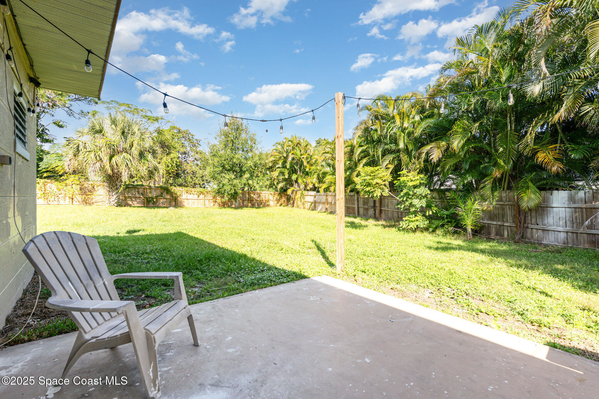 1137 Delmar Terrace Palm Bay, FL 32905 - Photo 21 of 35 a view of backyard with swimming pool and outdoor seating