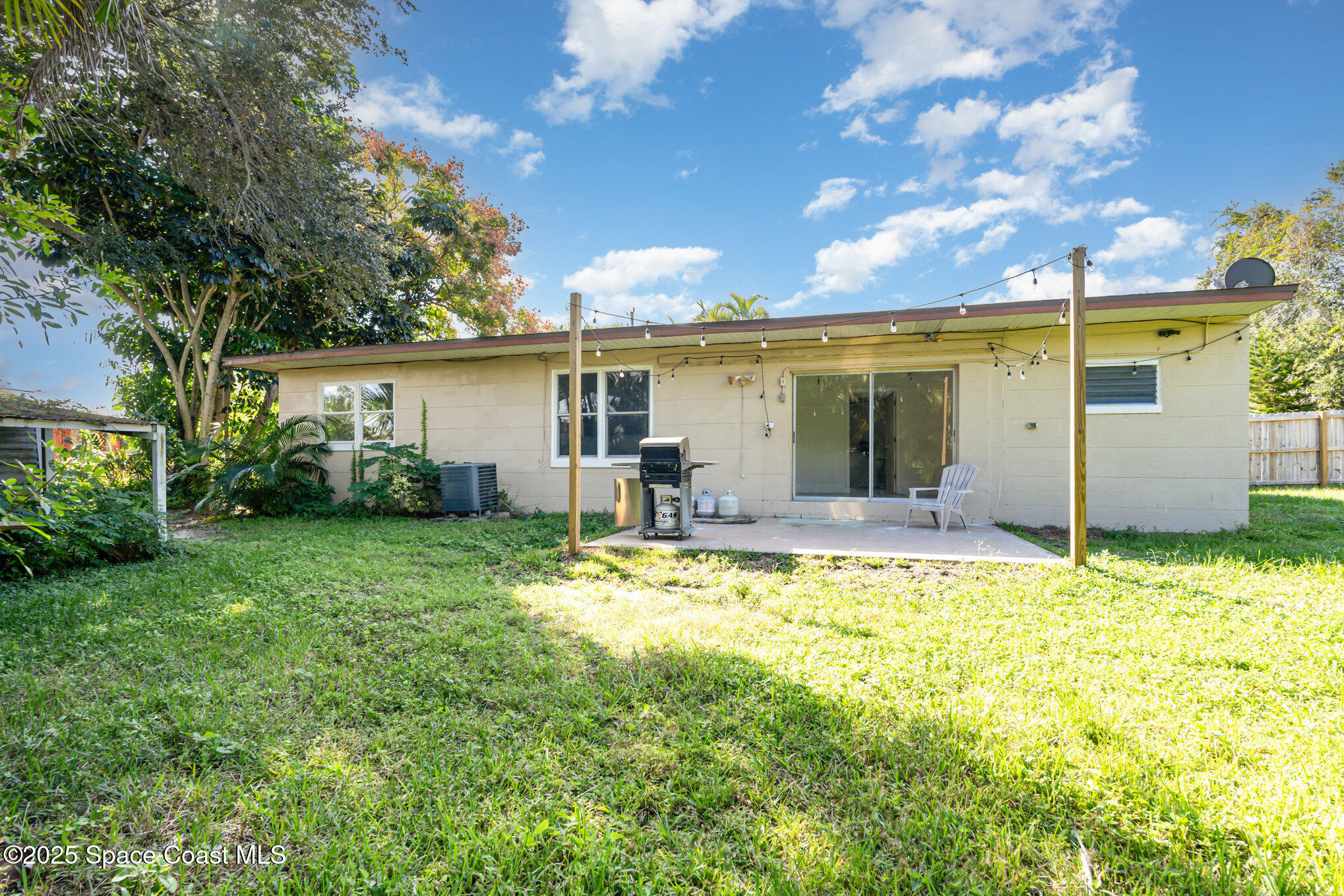 1137 Delmar Terrace Palm Bay, FL 32905 - Photo 24 of 35 a view of a house with backyard and sitting area