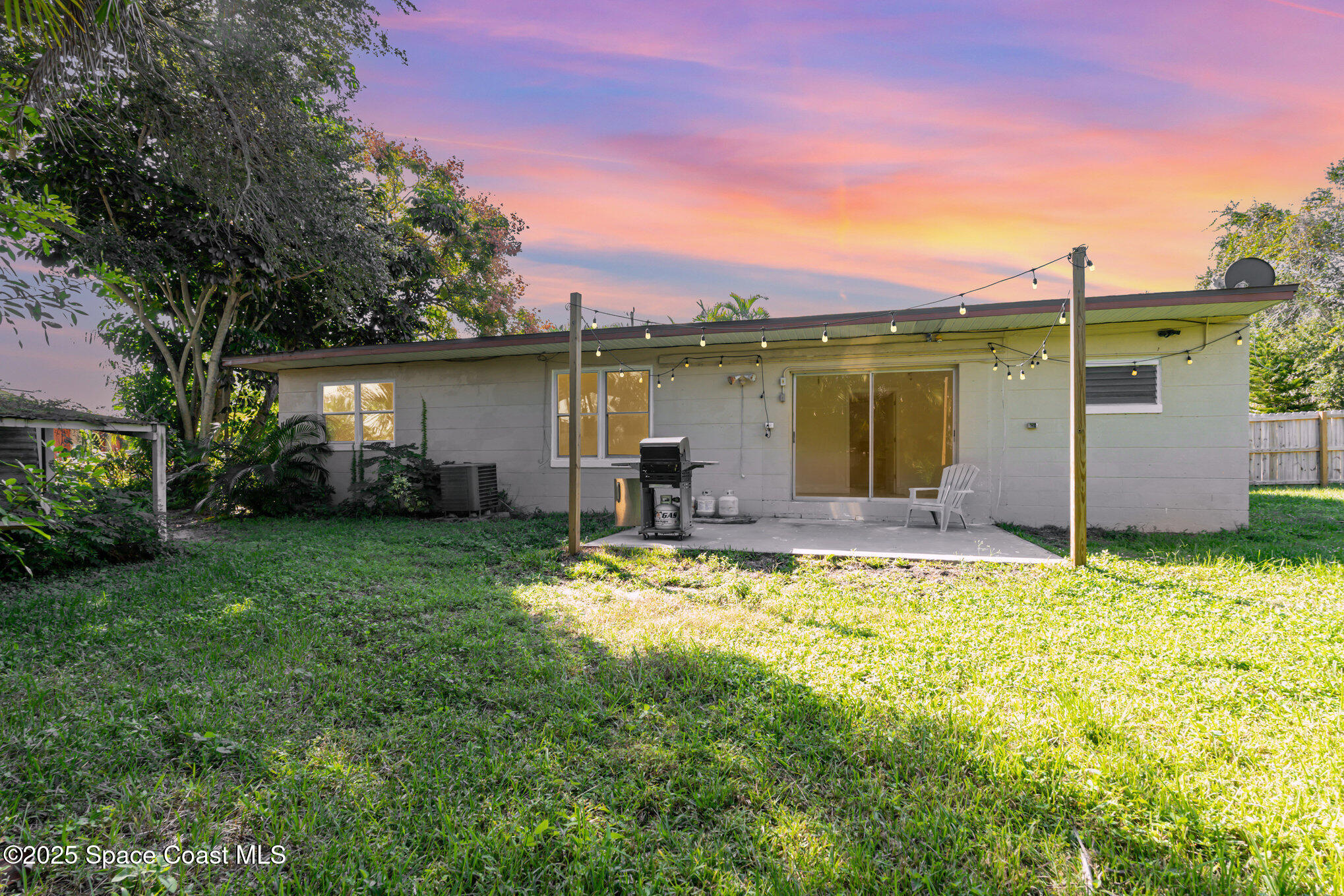 1137 Delmar Terrace Palm Bay, FL 32905 - Photo 27 of 35 a view of a house with a yard
