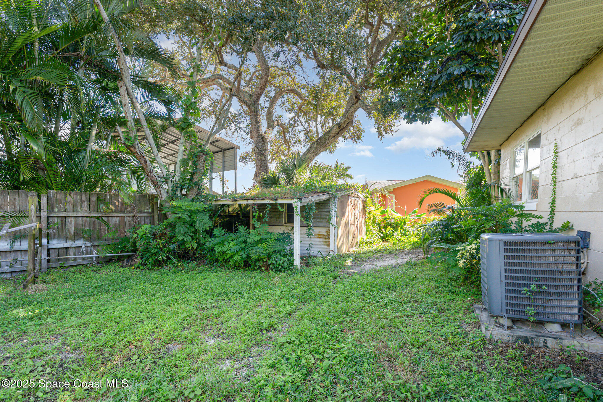 1137 Delmar Terrace Palm Bay, FL 32905 - Photo 28 of 35 a view of a house with a yard