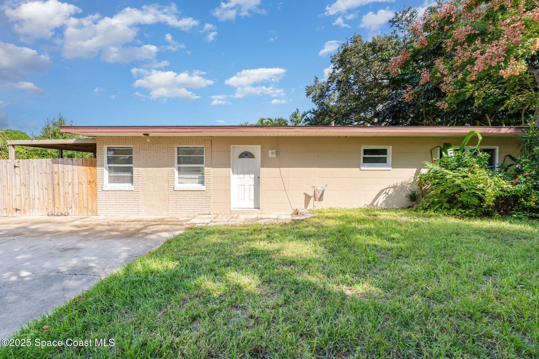 1137 Delmar Terrace Palm Bay, FL 32905 - Photo 30 of 35 front view of a house with yard