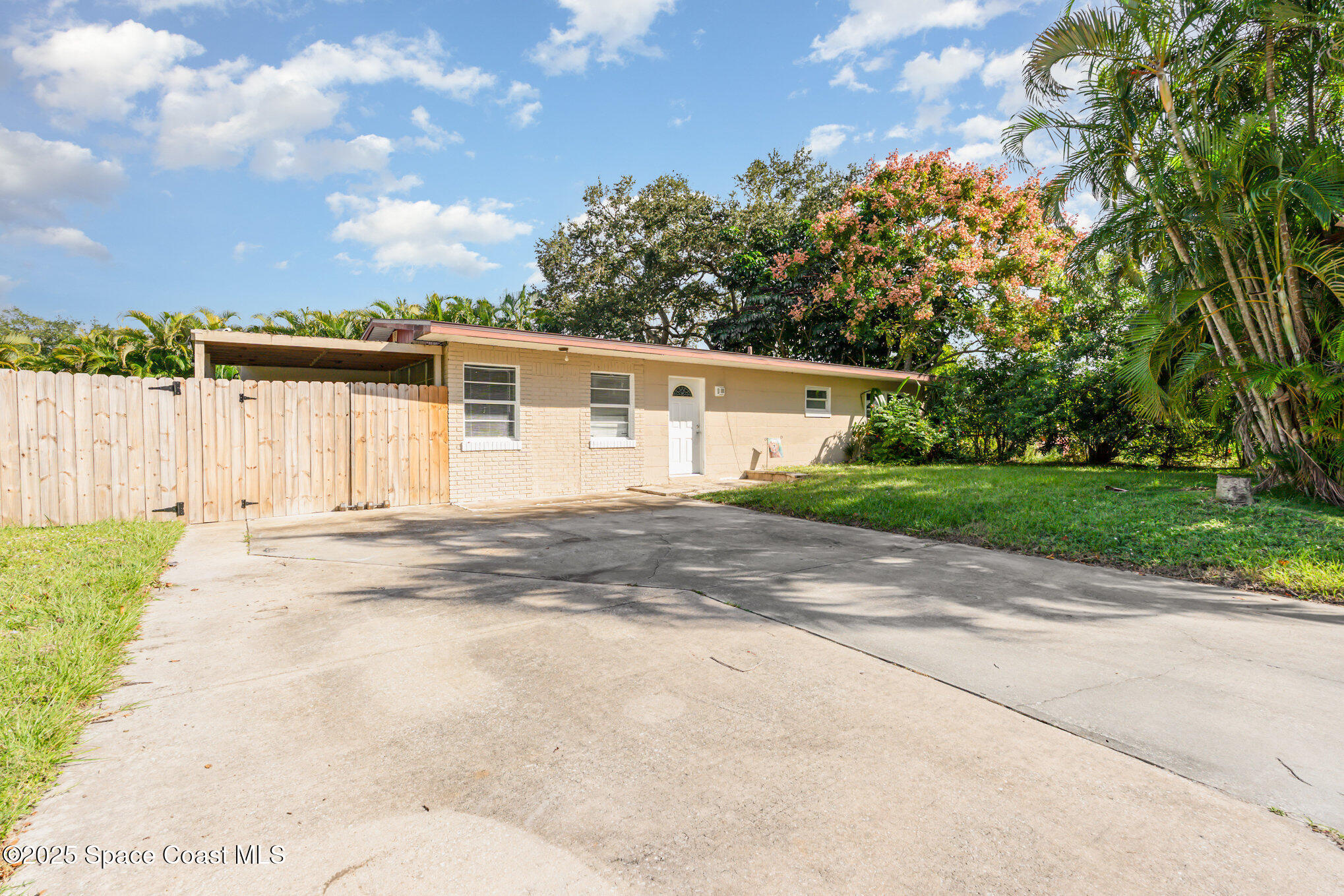 1137 Delmar Terrace Palm Bay, FL 32905 - Photo 31 of 35 a view of backyard of house with green space
