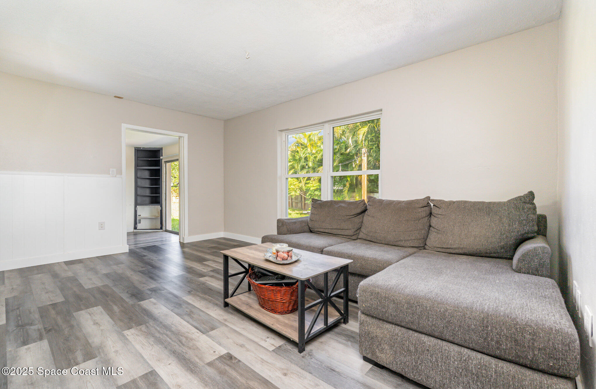 1137 Delmar Terrace Palm Bay, FL 32905 - Photo 4 of 35 a living room with furniture and a window