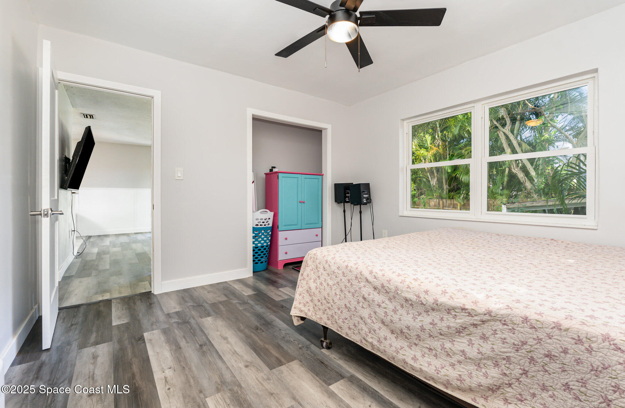 1137 Delmar Terrace Palm Bay, FL 32905 - Photo 9 of 35 a bed room with a bed and a large window