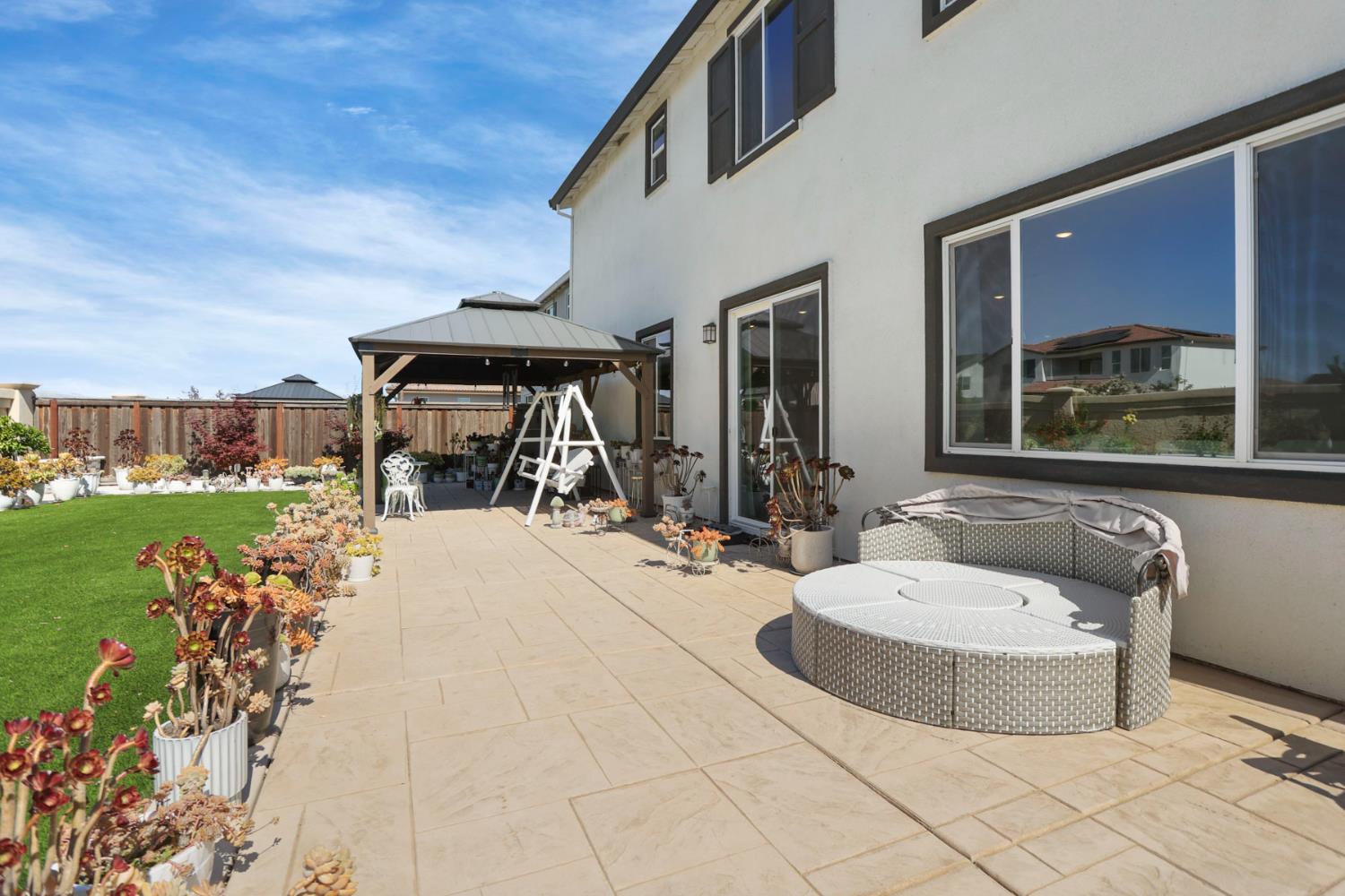 6949 Foraker Drive Stockton, CA 95219 - Photo 2 of 34 a view of a house with sitting area and garden