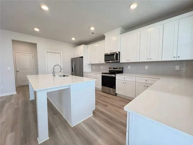 a view of an empty room and a window