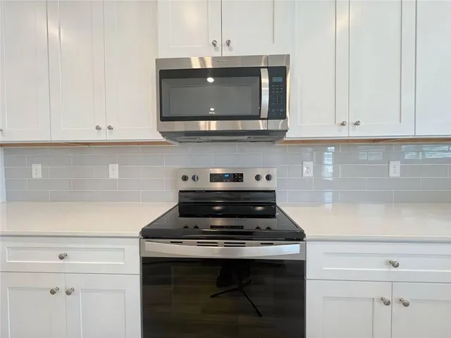 a bathroom with a shower and a bath tub