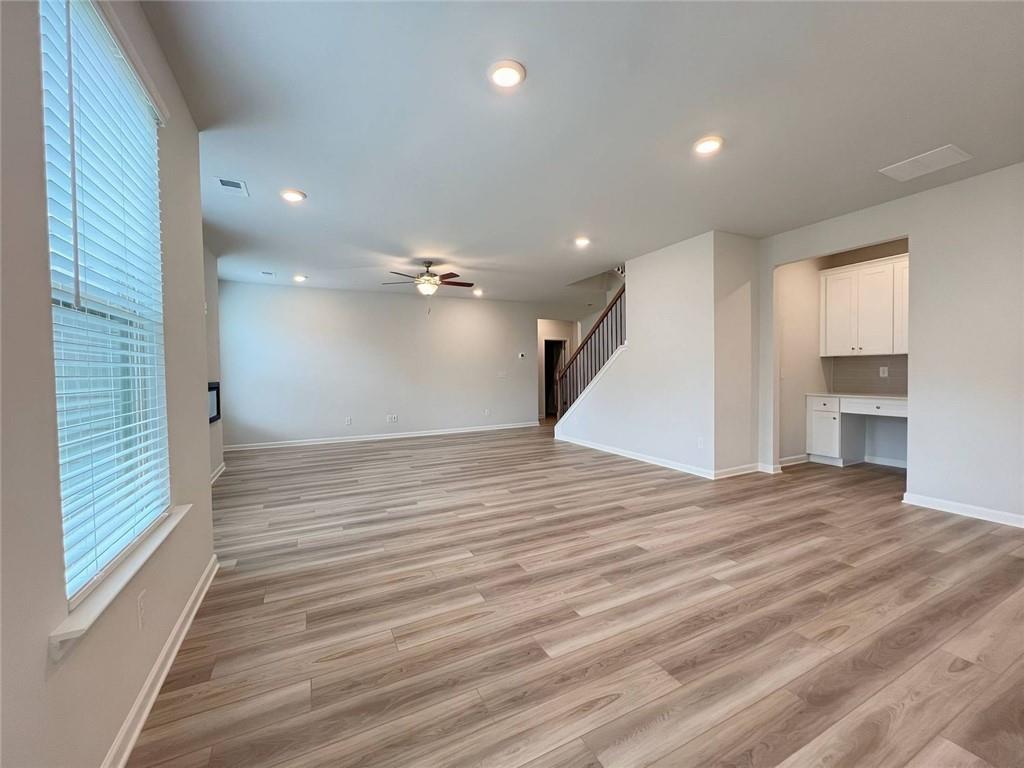 2790 Dolce Road Dacula, GA 30019 - Photo 20 of 66 a view of empty room with wooden floor and entryway