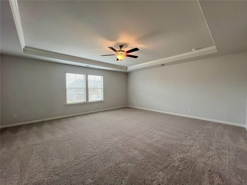 2790 Dolce Road Dacula, GA 30019 - Photo 40 of 66 an empty room with windows and ceiling fan view