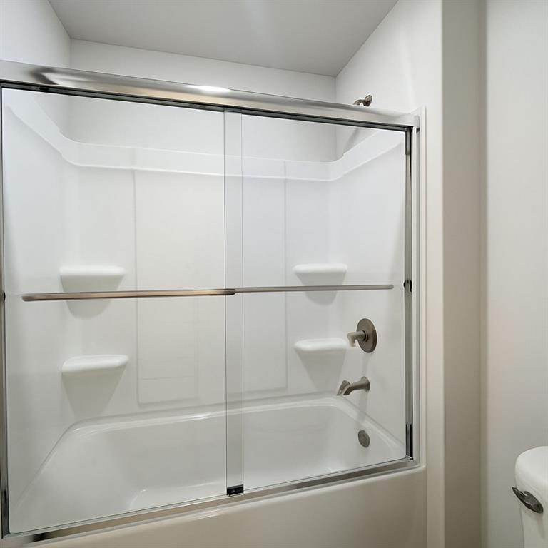 2790 Dolce Road Dacula, GA 30019 - Photo 60 of 66 a bathroom with a shower and a bath tub