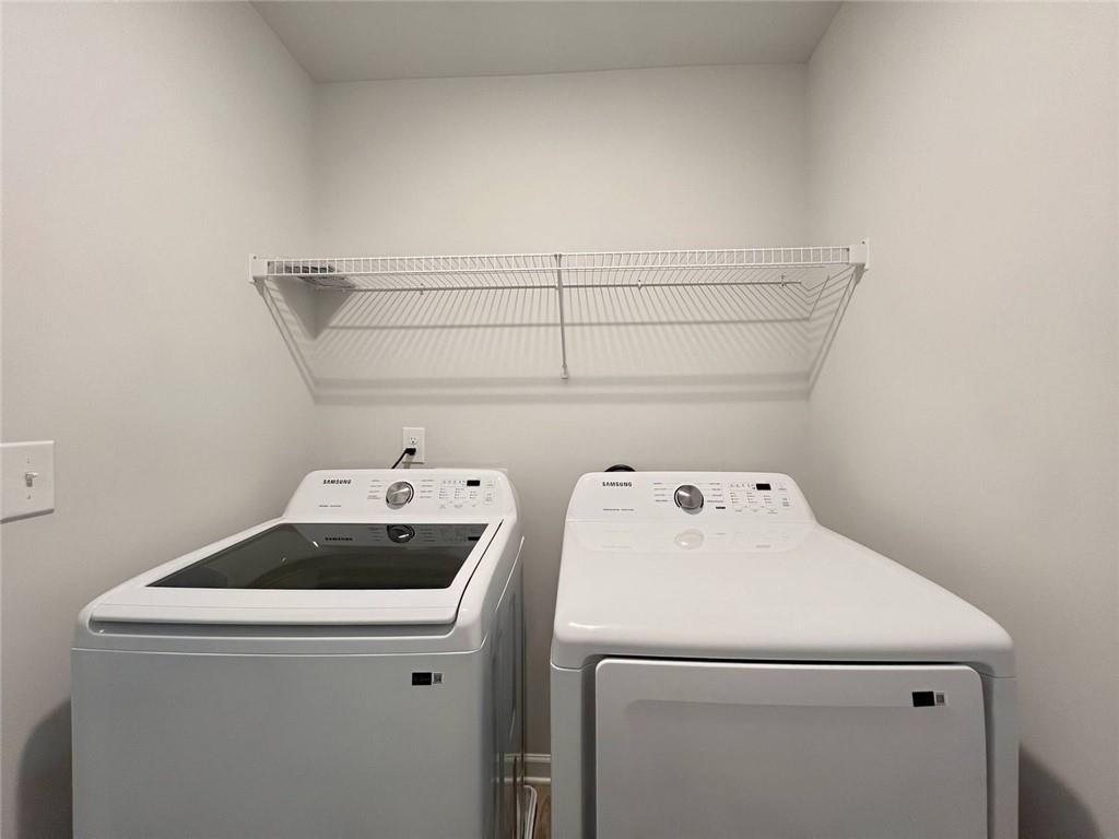 2790 Dolce Road Dacula, GA 30019 - Photo 62 of 66 a utility room with dryer and washer