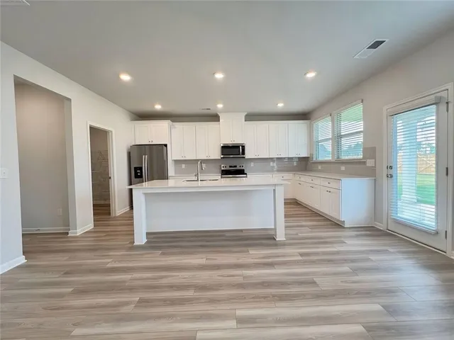 a bathroom with a glass shower door