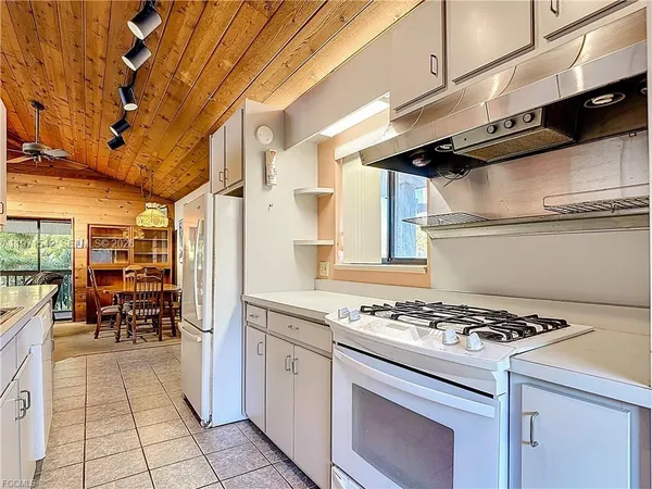 a bathroom with a shower a toilet and a sink
