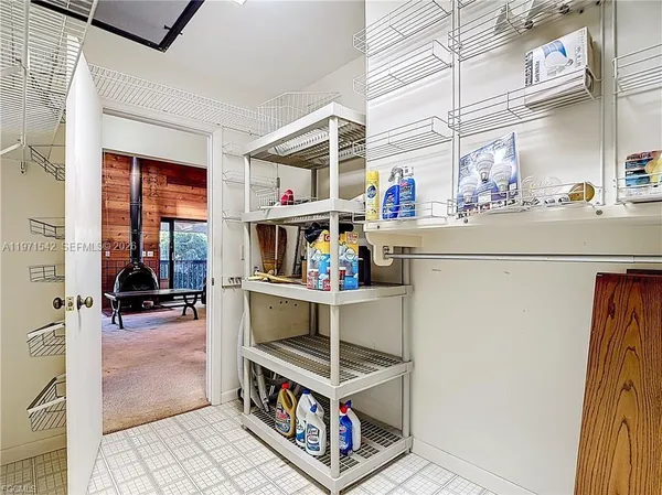 a view of an empty room with racks on the wall