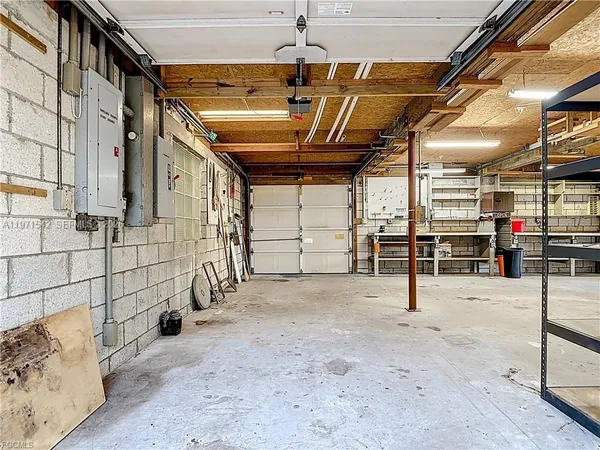 a view of a patio with chairs and umbrellas on a wooden floor