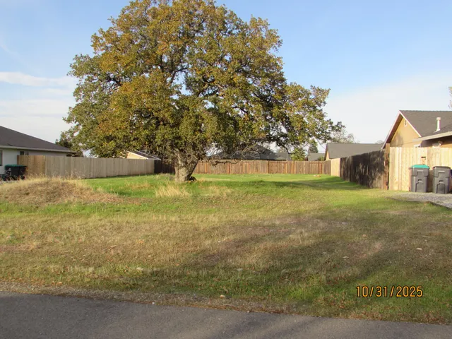 a view of pool with tree in the background