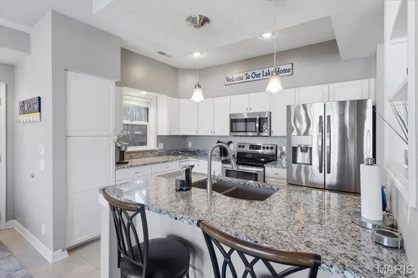 $499,000 | 117 Evergreen Condo Drive, Unit 1B, Sunrise Beach, MO 65079