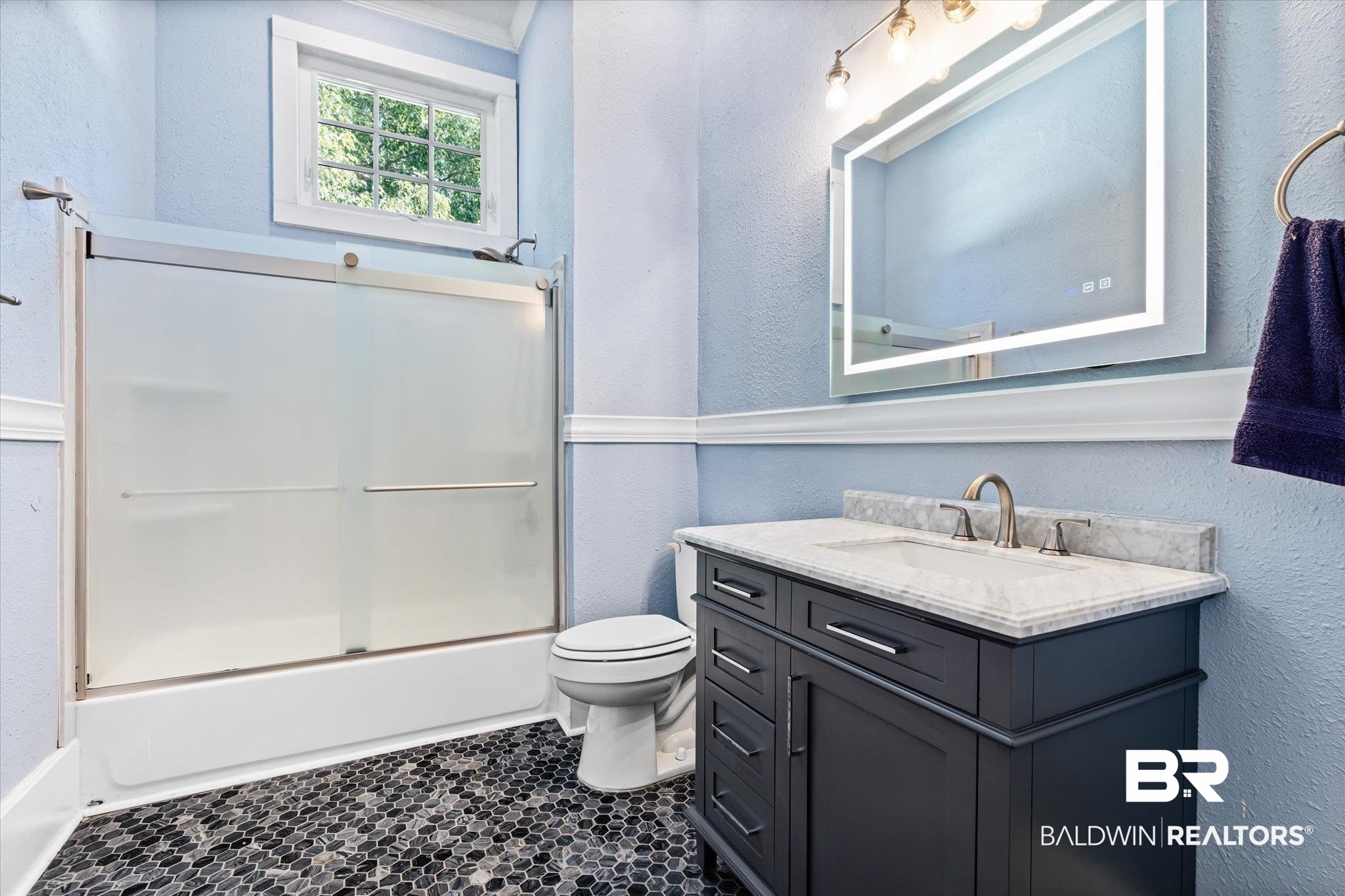1310 Brown Street Mobile, AL 36604 - Photo 7 of 18 Full bathroom featuring vanity, bath / shower combo with glass door, and toilet