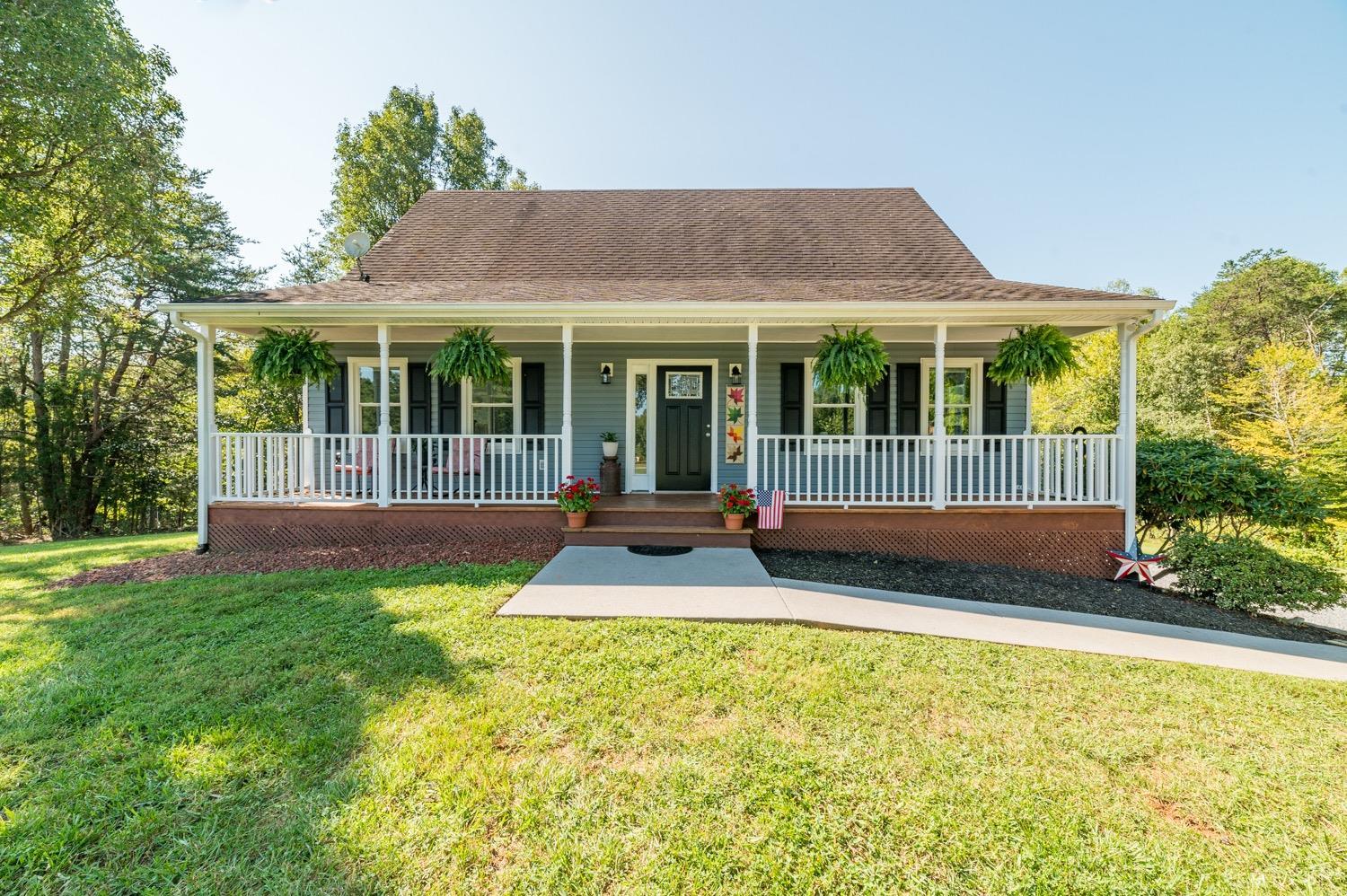 a view of house with a garden