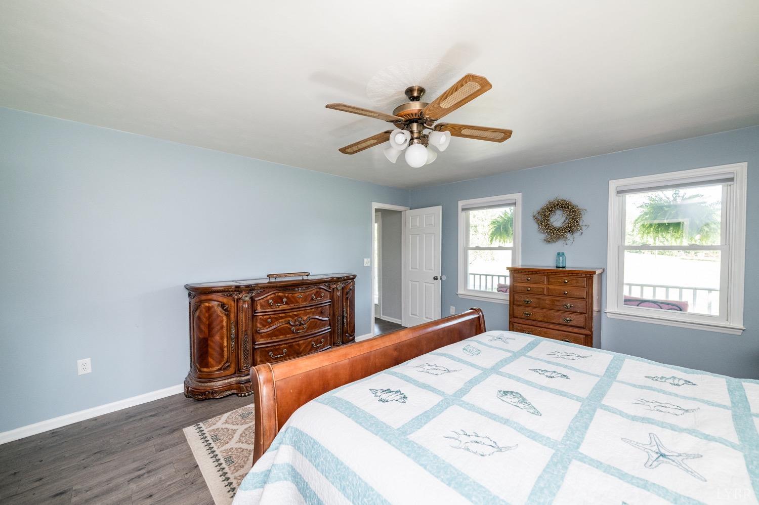 7996 Rocky Ford Road Moneta, VA 24121 - Photo 12 of 45 a bed room with a bed mirror and a window