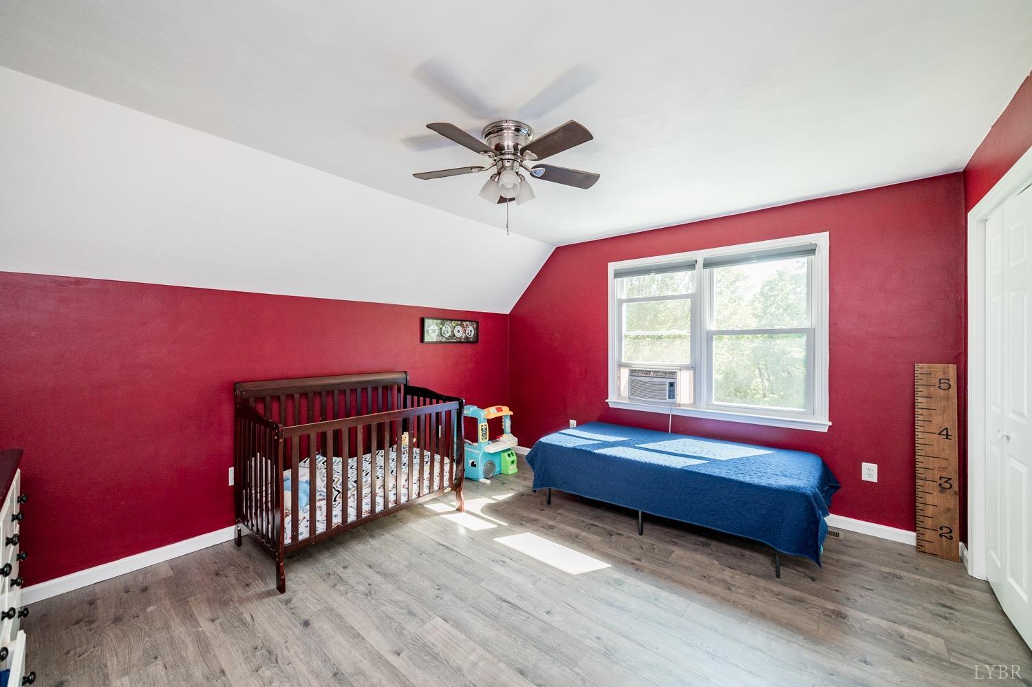 7996 Rocky Ford Road Moneta, VA 24121 - Photo 16 of 45 a bedroom with a bed and window