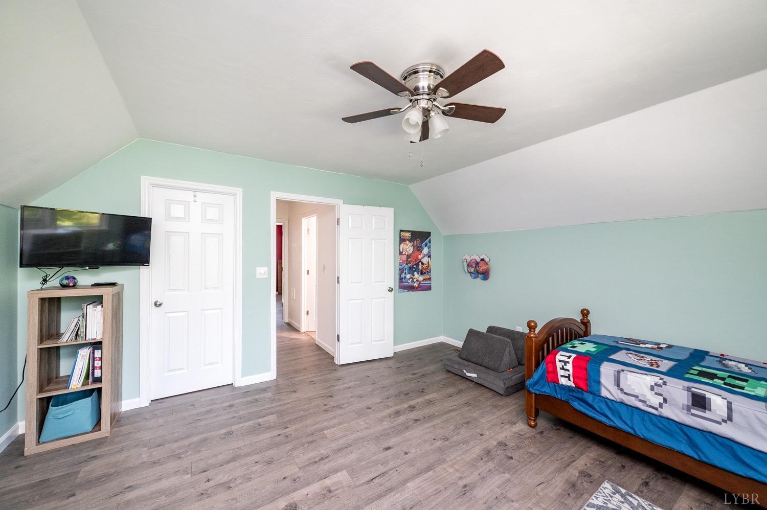 7996 Rocky Ford Road Moneta, VA 24121 - Photo 19 of 45 a living room with furniture and a flat screen tv