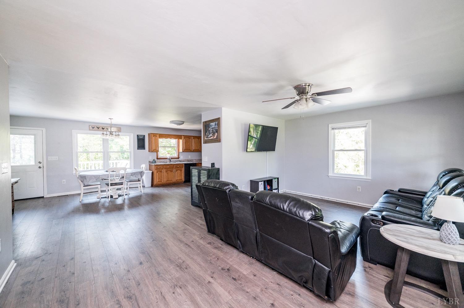 7996 Rocky Ford Road Moneta, VA 24121 - Photo 2 of 45 a living room with furniture and wooden floor