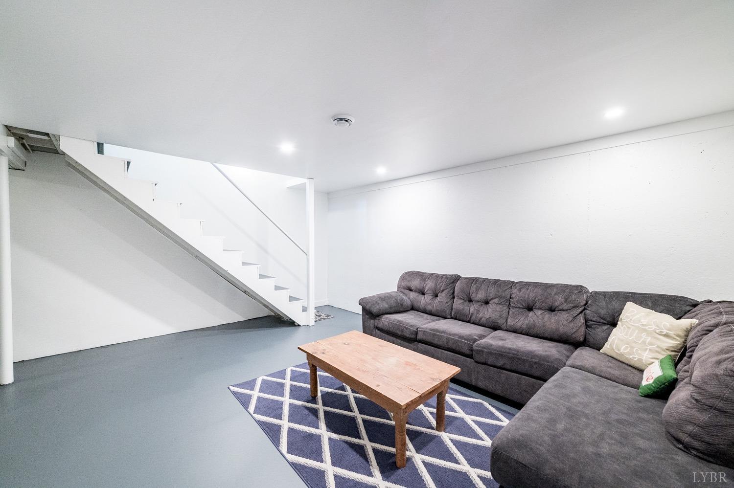 7996 Rocky Ford Road Moneta, VA 24121 - Photo 21 of 45 a living room with furniture and a couch