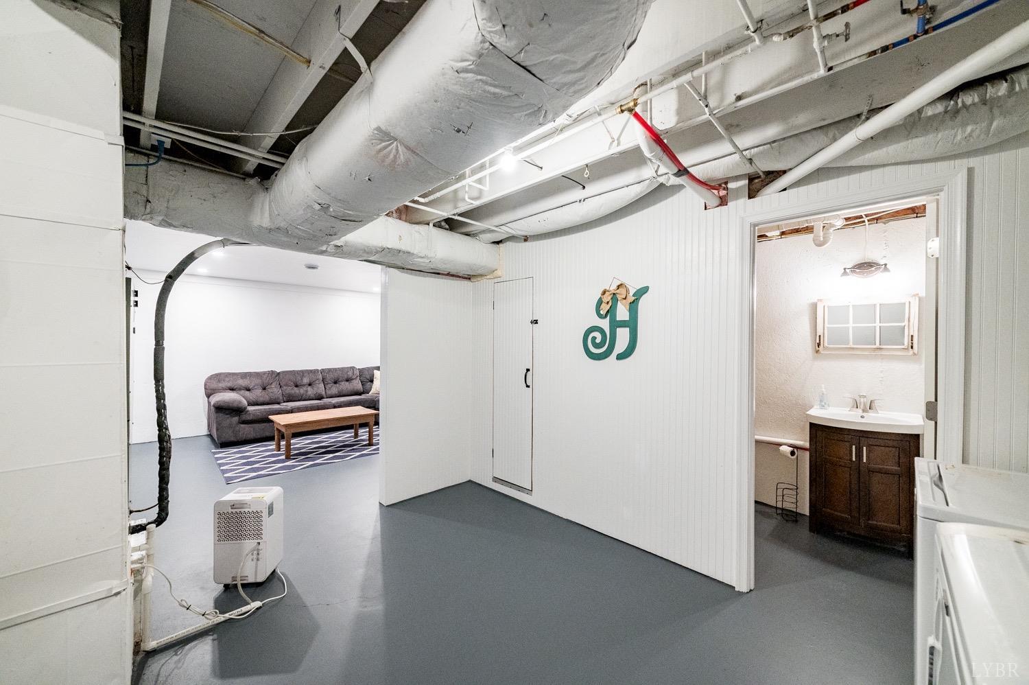 7996 Rocky Ford Road Moneta, VA 24121 - Photo 23 of 45 a view of a storage & utility room with refrigerator and windows