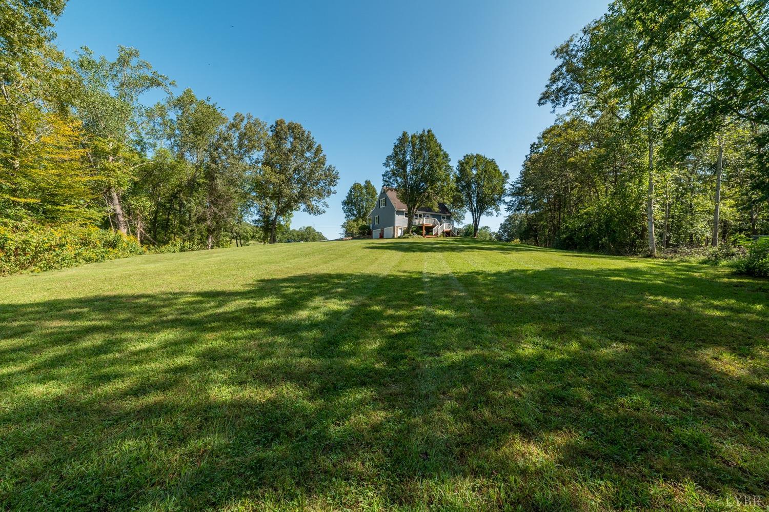 7996 Rocky Ford Road Moneta, VA 24121 - Photo 30 of 45 a view of a big yard with plants and trees