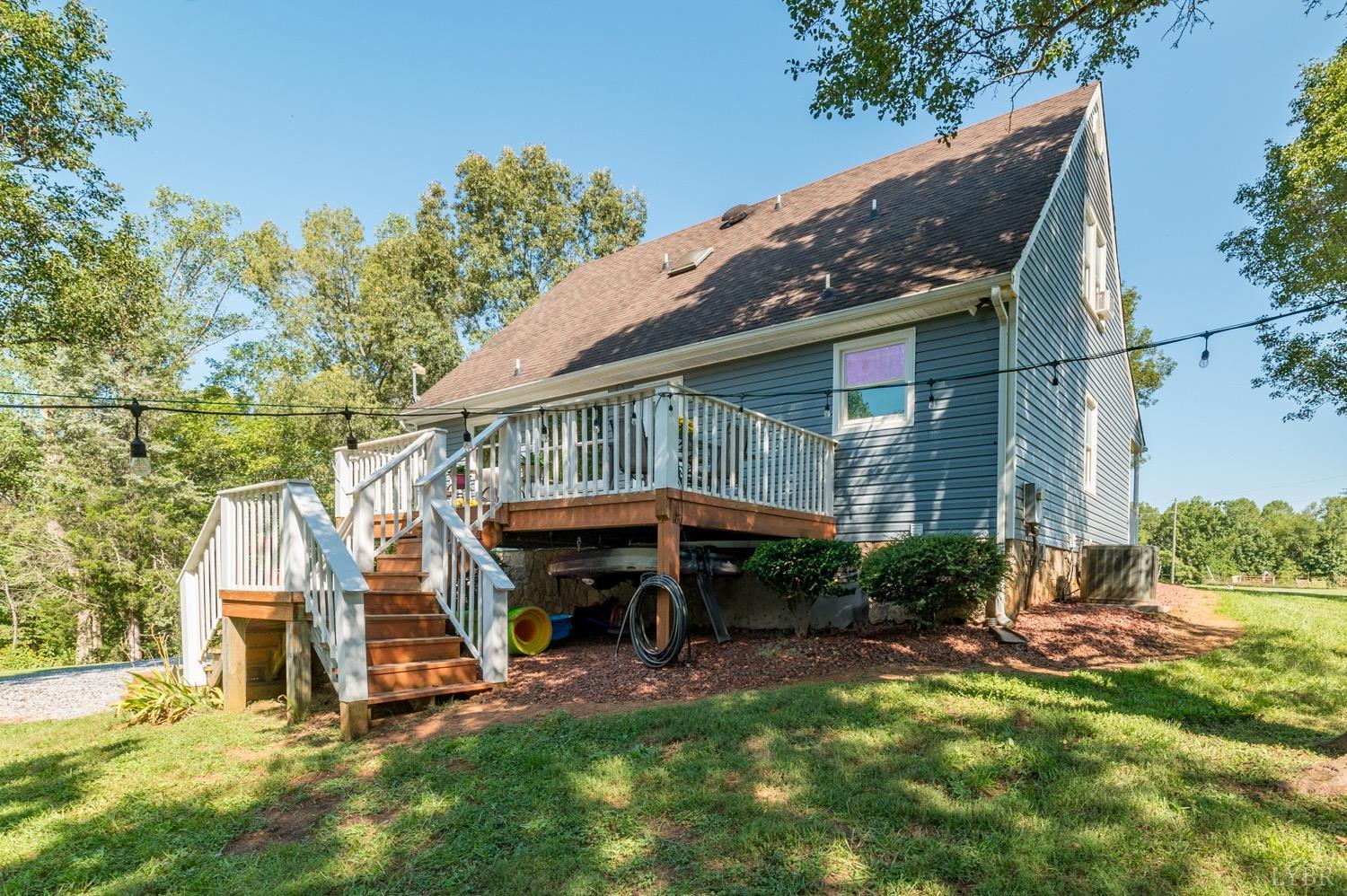 7996 Rocky Ford Road Moneta, VA 24121 - Photo 31 of 45 a view of house with backyard and furniture