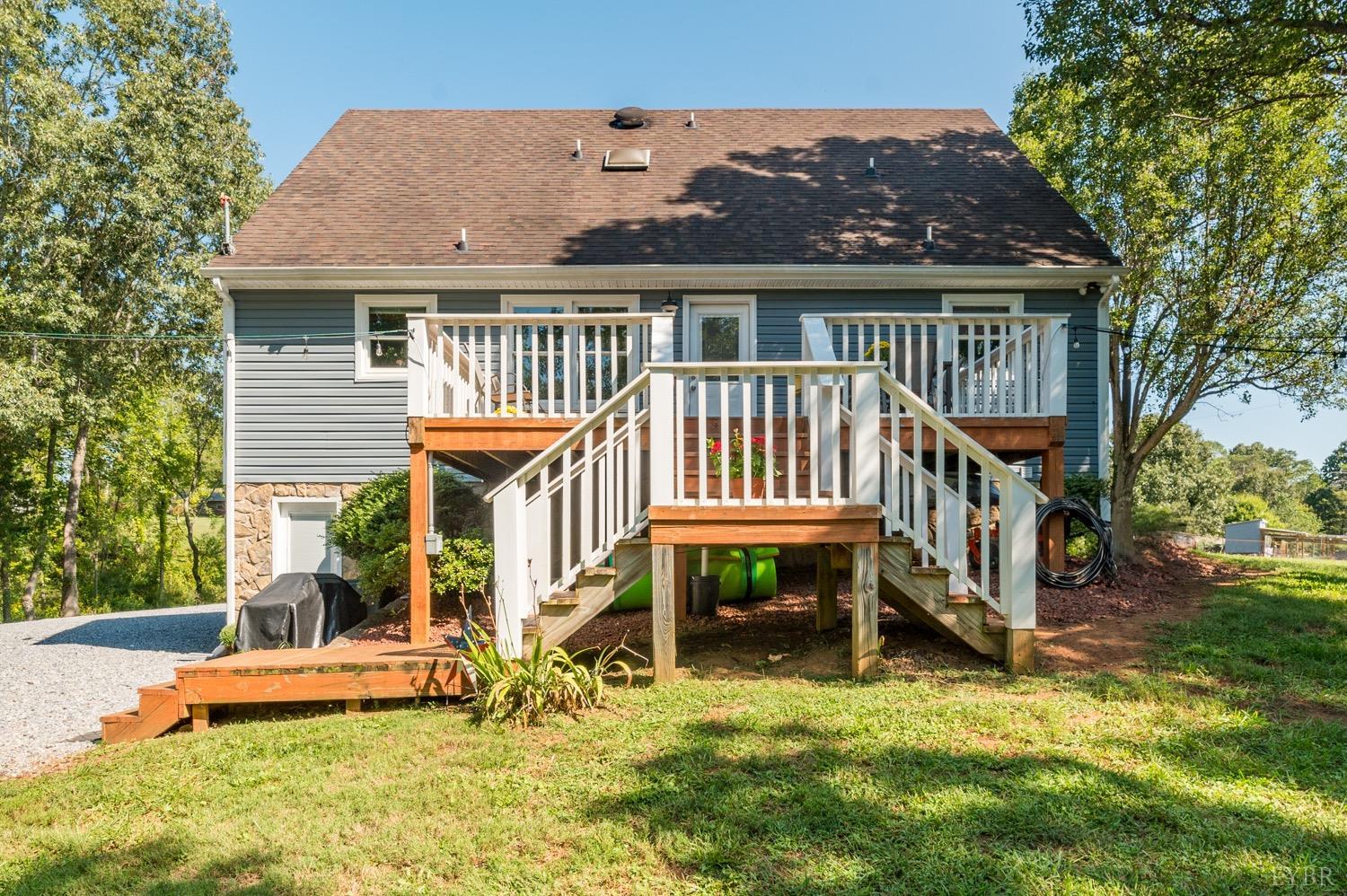 7996 Rocky Ford Road Moneta, VA 24121 - Photo 32 of 45 a view of a house with backyard porch and sitting area