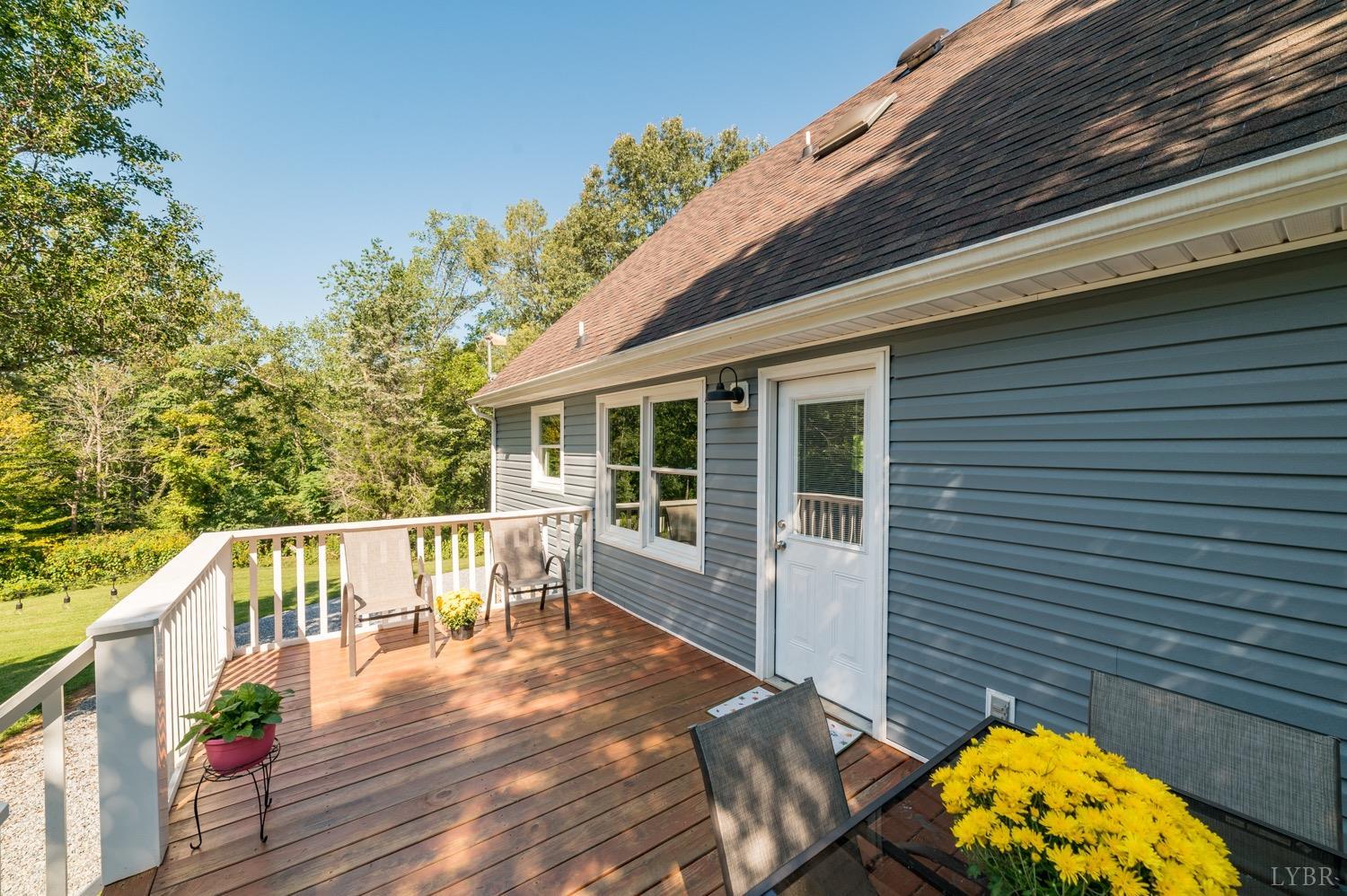 7996 Rocky Ford Road Moneta, VA 24121 - Photo 33 of 45 a view of a house with backyard and sitting area