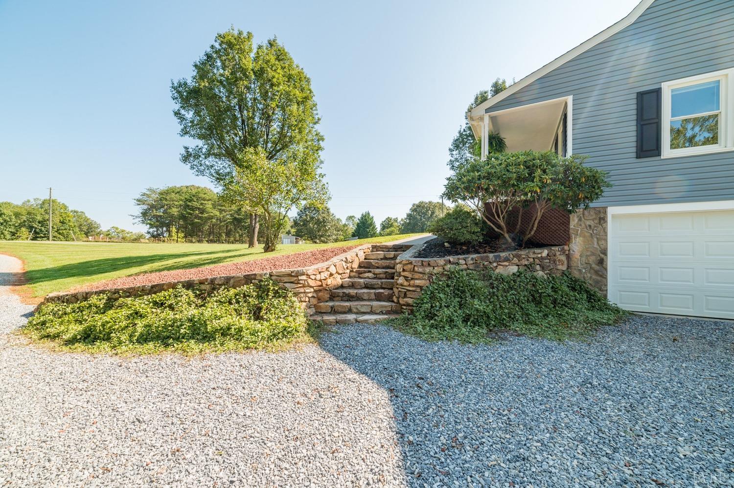 7996 Rocky Ford Road Moneta, VA 24121 - Photo 37 of 45 a view of a garden with a pathway