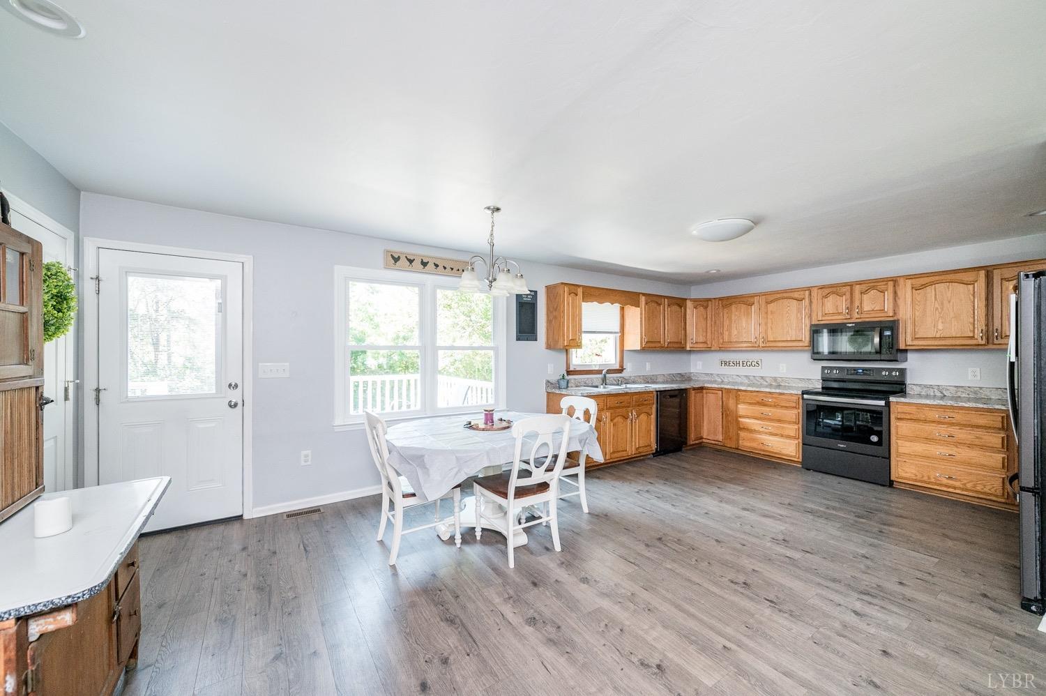 7996 Rocky Ford Road Moneta, VA 24121 - Photo 5 of 45 a kitchen with a table and chairs in it