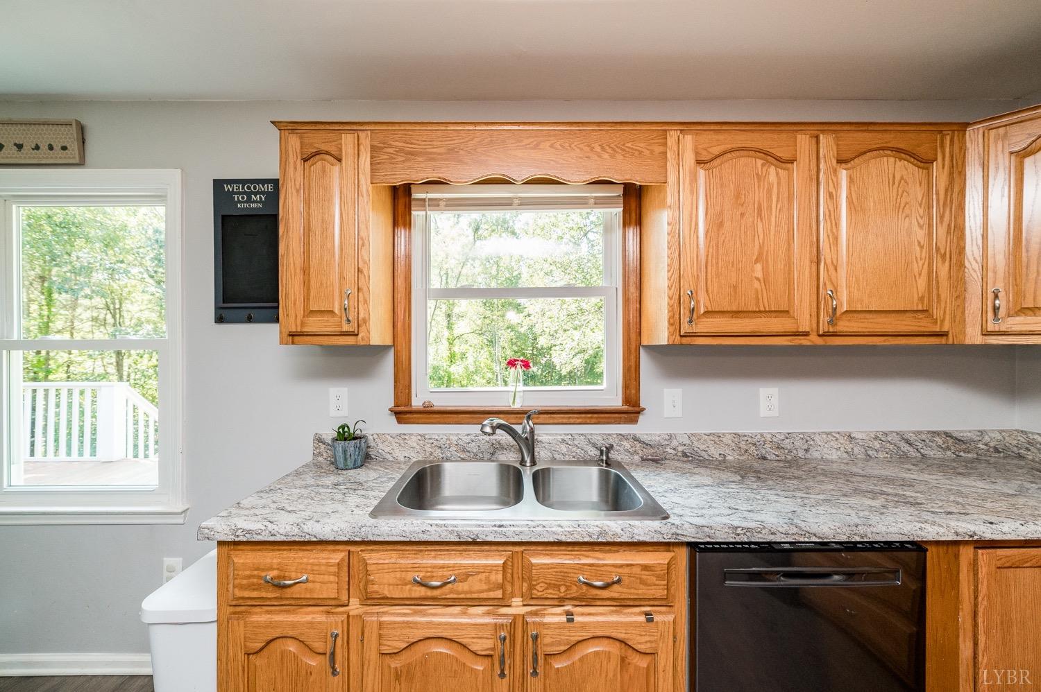 7996 Rocky Ford Road Moneta, VA 24121 - Photo 8 of 45 a kitchen with granite countertop cabinets sink and window